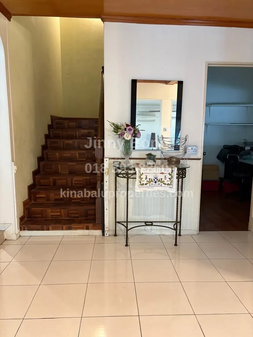 Staircase with office room on the right