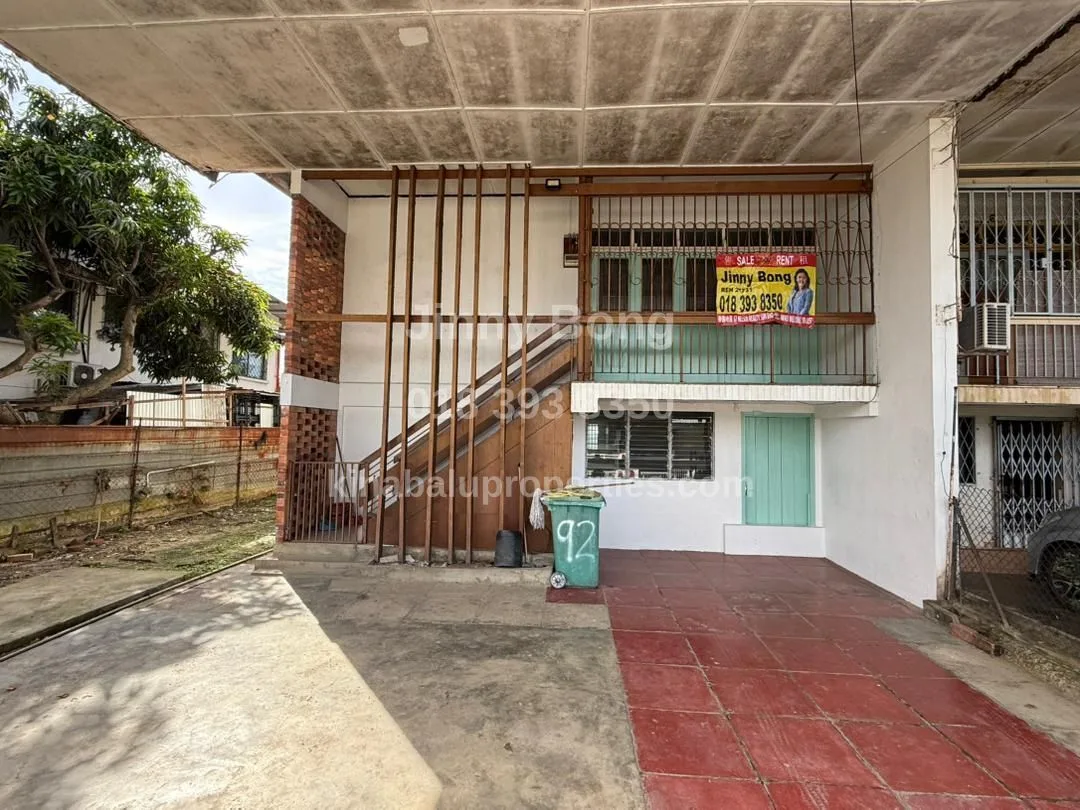 Front of the house with outdoor staircase and covered area